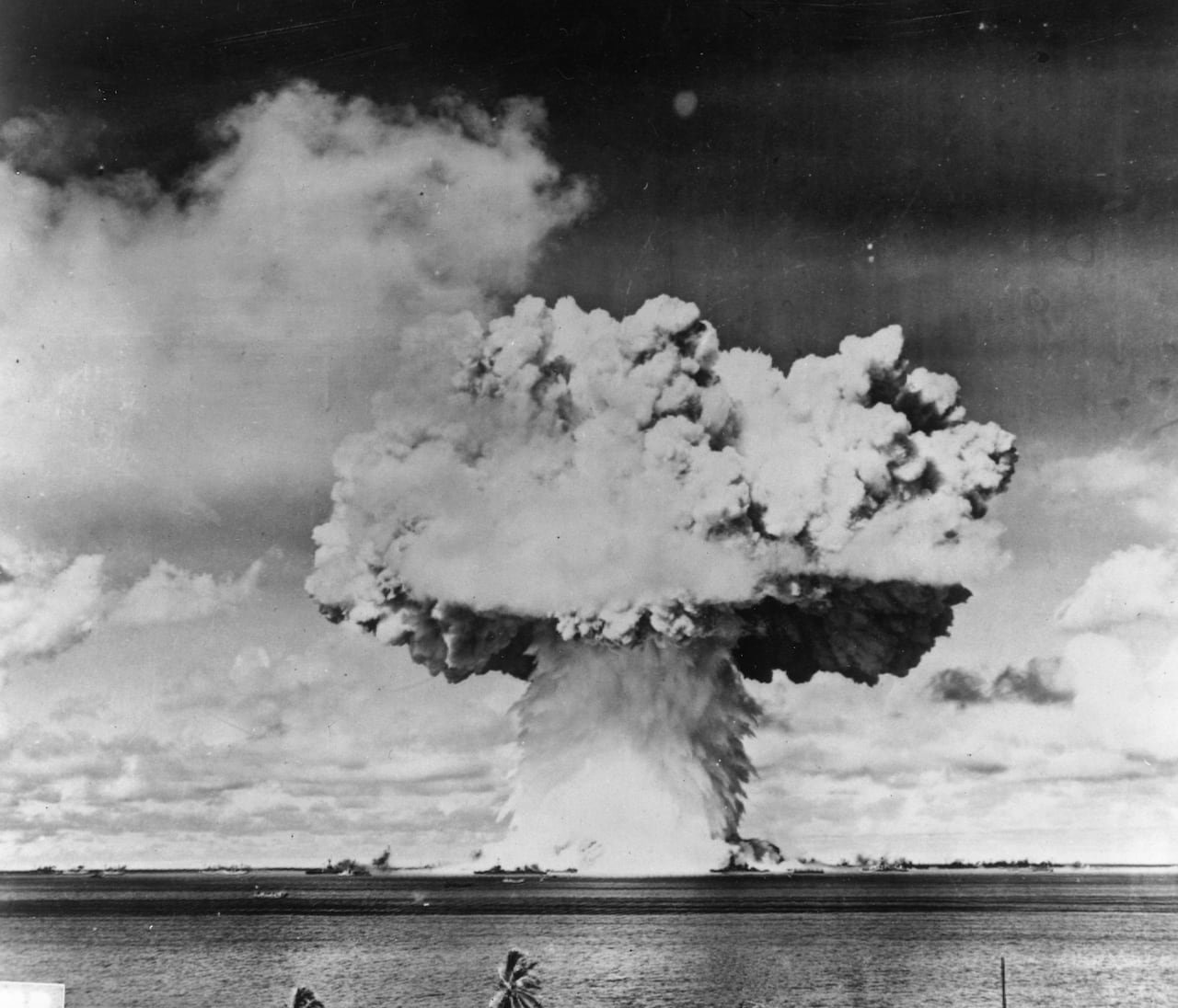 default-194 A black and white photo of a mushroom cloud over the ocean