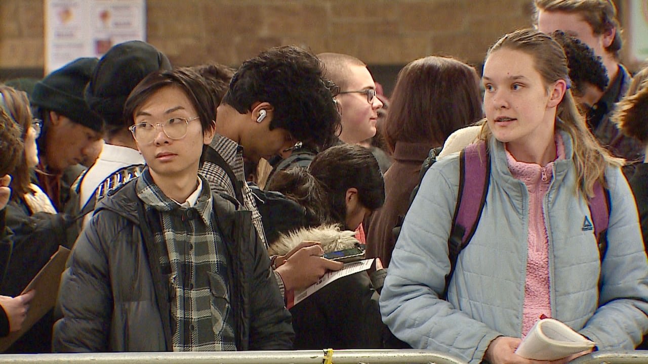 Two young individuals at a job fair