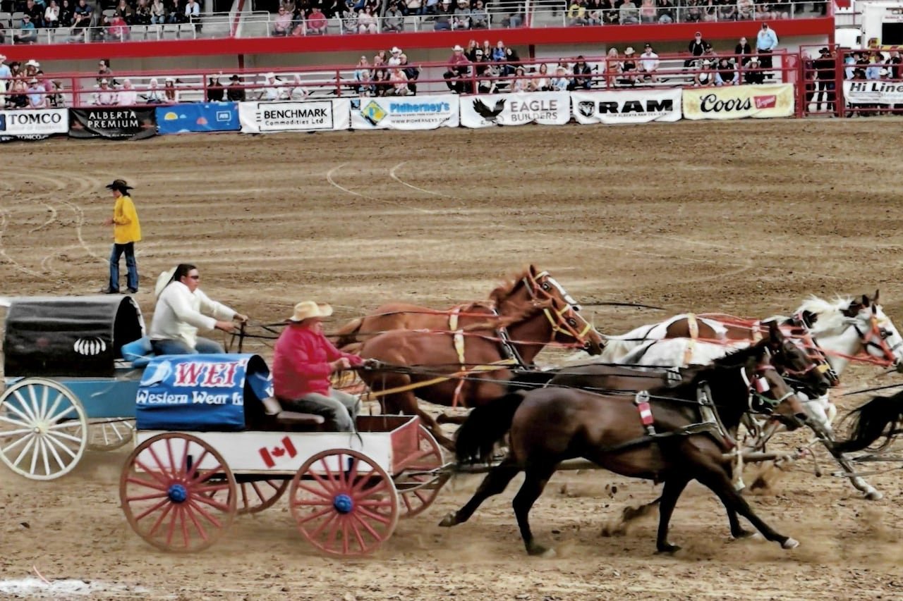default-34 An old photo of a cart drawn by horses which says "Wei's."