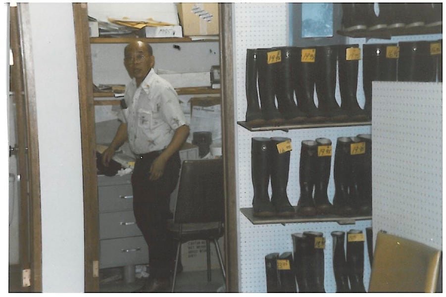 default-35 A man looks surprised in the doorframe surrounded by boots.